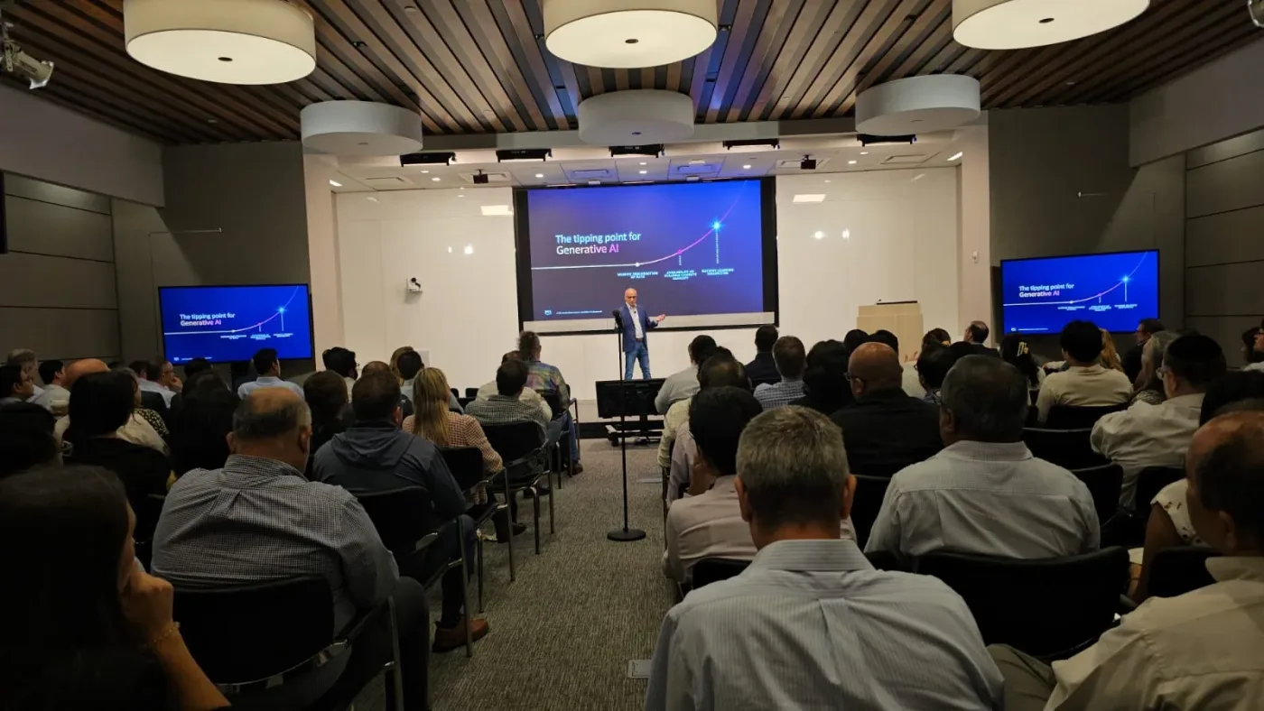 Ritesh Vajariya delivering an enterprise AI training session to a room of professionals in New York.